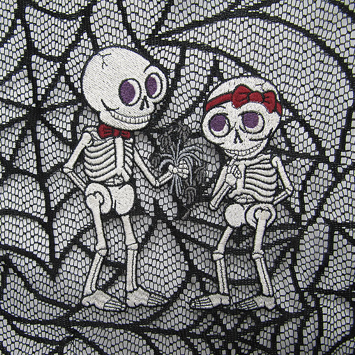skeleton couple on black lace