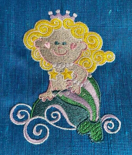 mermaid riding the waves