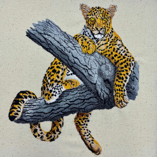 Leopard in tree embroidery design