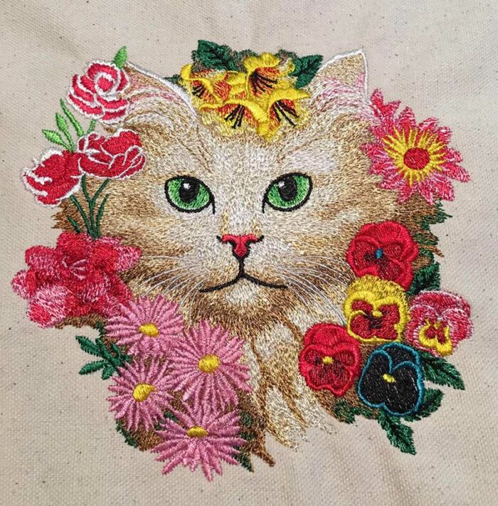 cat face with flowers sew out