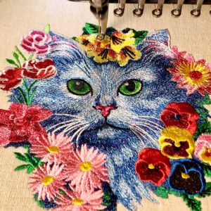 cat with flowers sewing out
