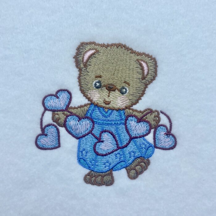 girl bear with string of hearts