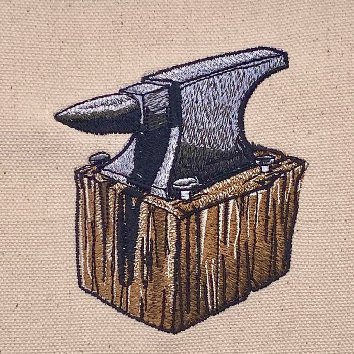 anivil on wood block embroidery design