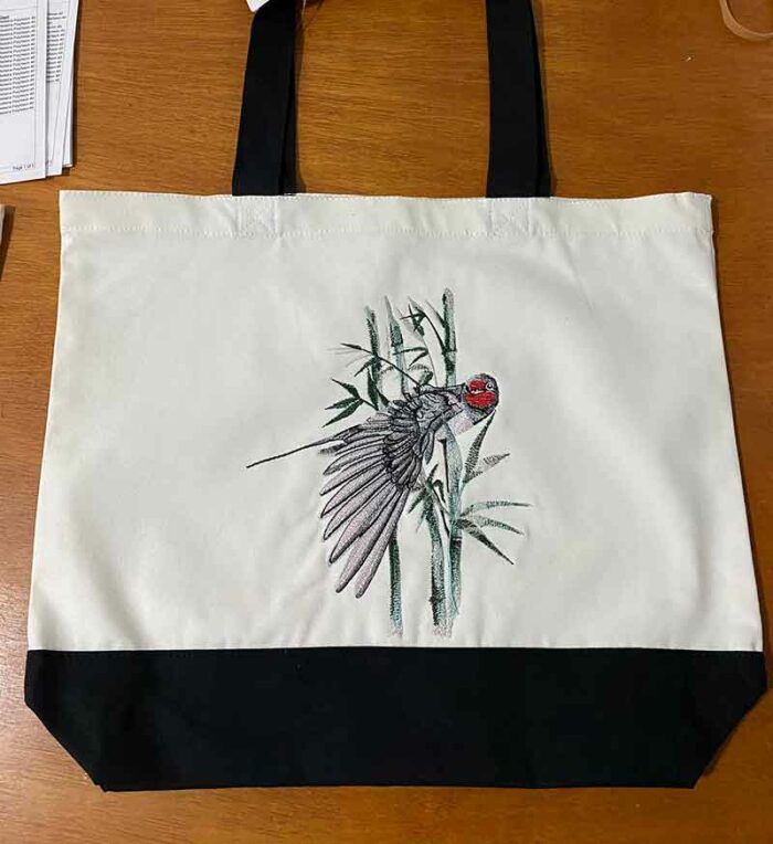 Okinawa bird with bamboo bag