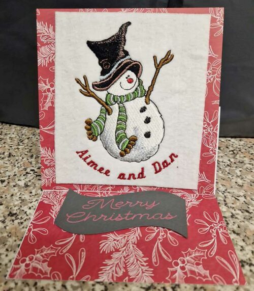 Snowman wearing hat Christmas card
