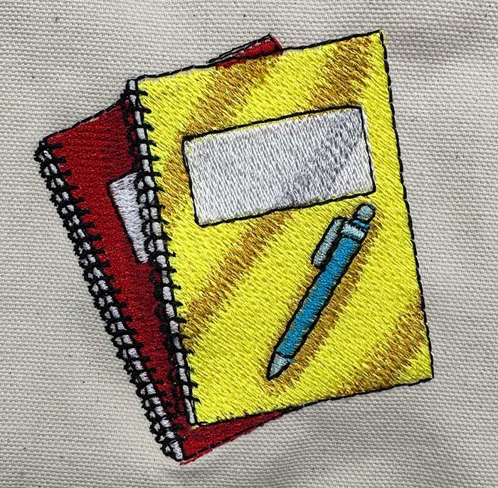 notebooks and pen embroidery design